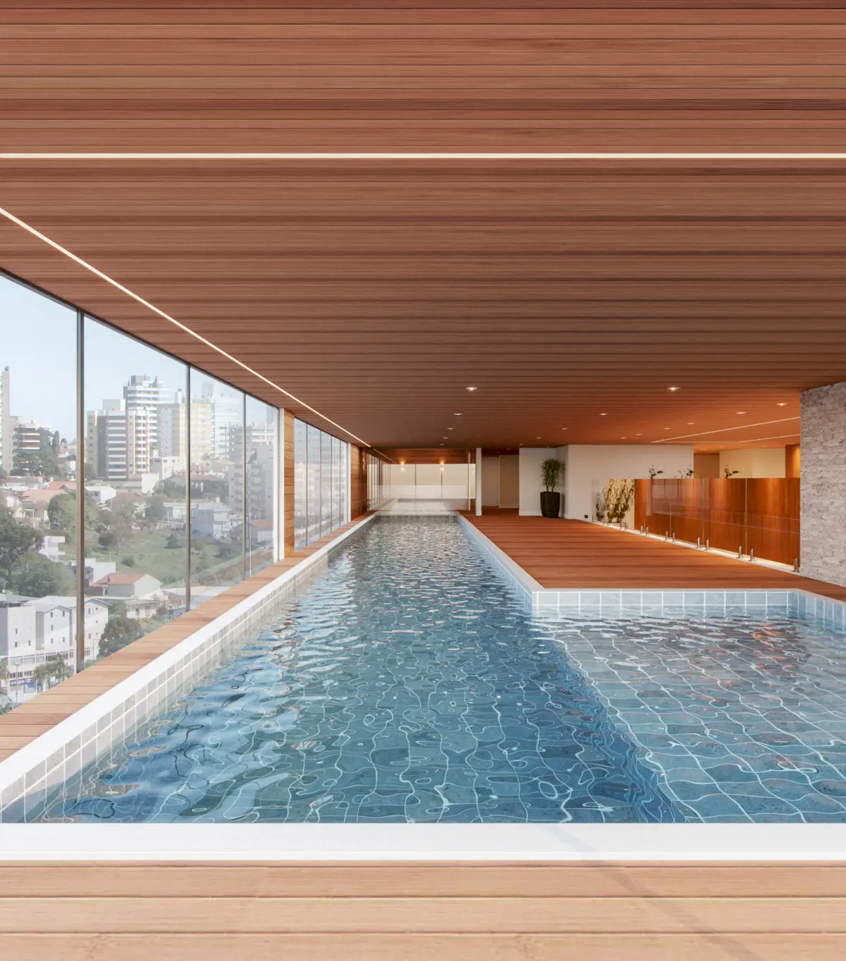 Piscina do 7º andar com pele de vidro voltada para a cidade