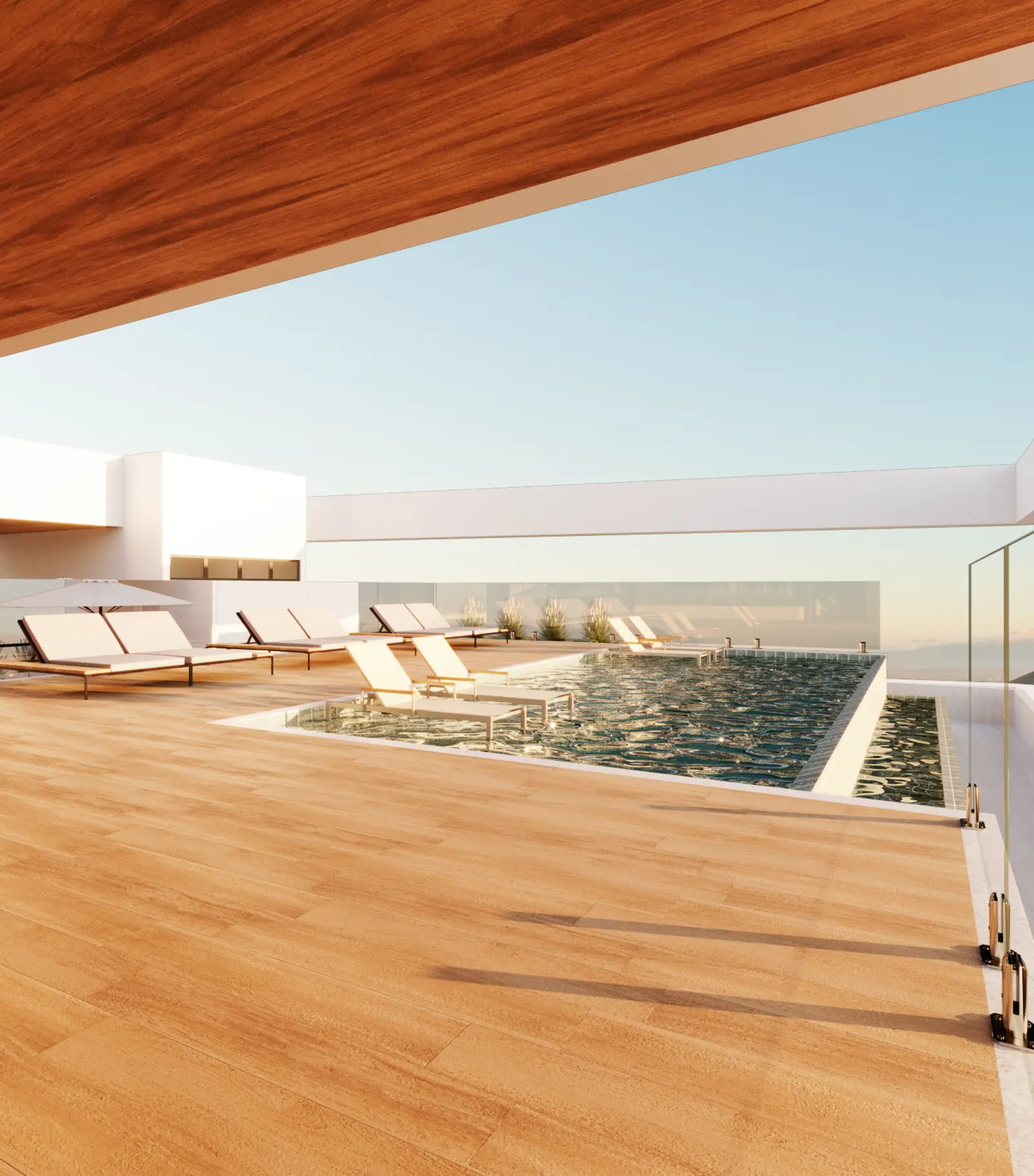Piscina de borda infinita do rooftop, com espreguiçadeiras e vista aberta para a cidade